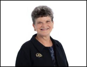 Ann Miller in front of a white background