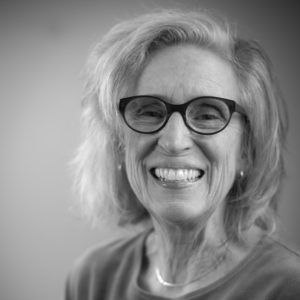 Black and white headshot photograph of Greta Nettleton