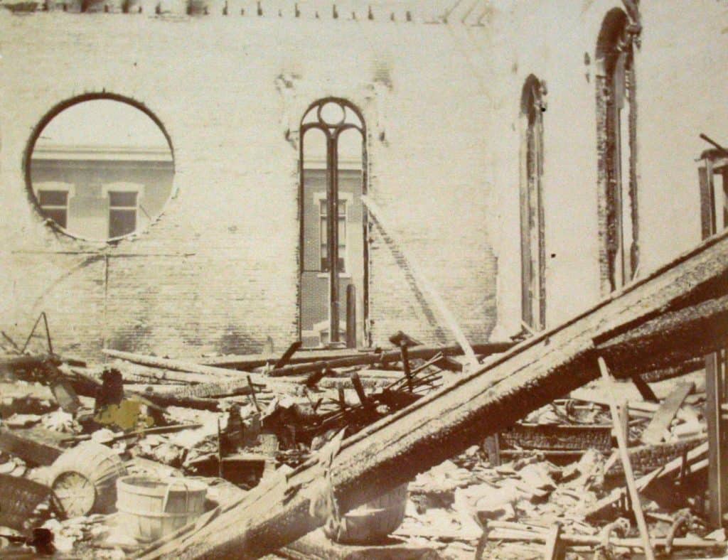 Here is another look at the destruction after the fire. The windows are glassless and there is debris all over the floor.