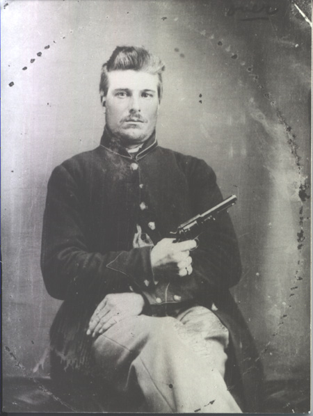 Georege Shearer holding pistol