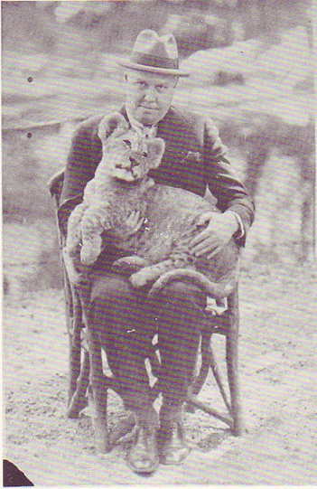 Carl van Vechten holding a lion cub in Berlin