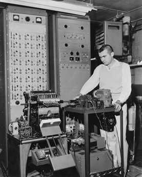 John V. McMillin II, ca. 1960, with scanner designed and built for Project Talent, a U.S. Office of Education-funded program