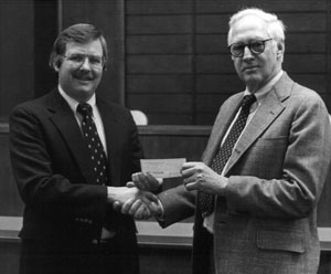 William Hines, dean of the UI College of Law, and Ralph Gearhart of the Iowa Defense Counsel Association, 1981