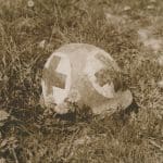 World War II helmet in a field