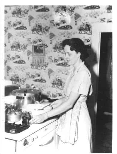 Evelyn Birkby canning on her stove, Shenandoah, Iowa, 1950s