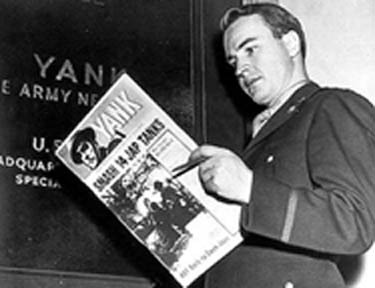 Capt. Hartzell Spence, editor of Yank, looks over a dummy copy of his weekly newspaper in 1942. 