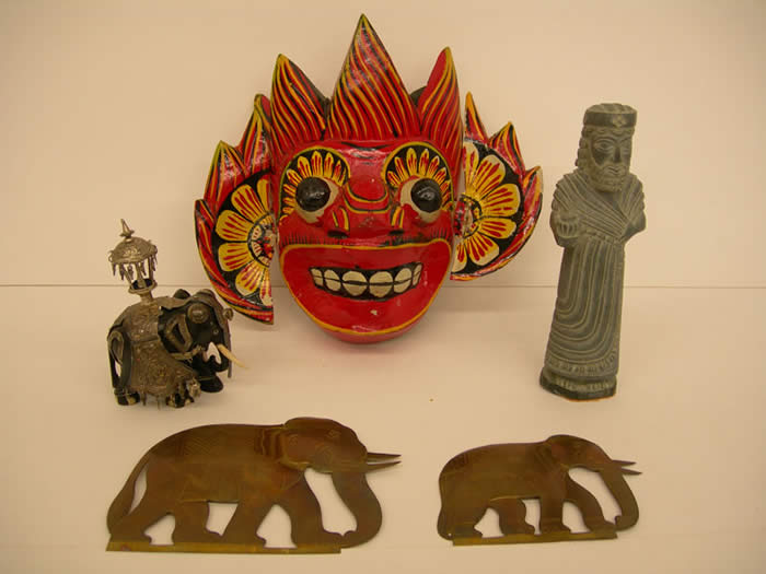 Ebony Elephant, Male Figure, Painted Mask, Brass Elephants