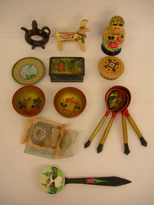 Currency, Hand-carved Box, Lacquered Box Doll, Bowls and Spoons, Wine Dispenser, Ceramic Plate, Ceramic "Dog" Whistle